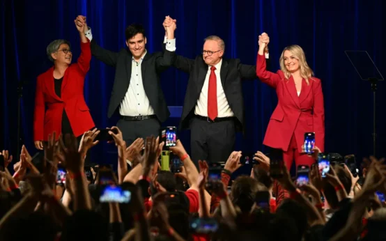 Australia's Prime Minister Anthony Albanese celebrates with his partner Jodie Haydon, son Nathan and Australia's Foreign Minister Penny Wong after winning the general election at the Labor Party election night event in Sydney on May 3. Saeed Khan/AFP/Getty Images
