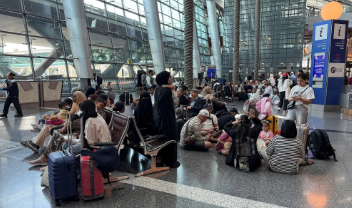 Airport Staff and Volunteers Try to Help Amid Overwhelming Pressure