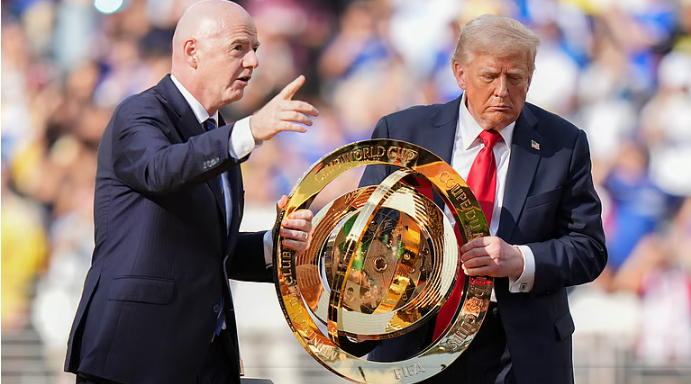 Donald Trump gives trophy as fans cheer and boo